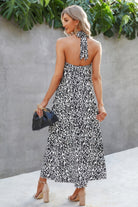Cutout animal print summer dress by VacationGrabs with halter neck and flowing silhouette