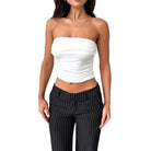 Woman wearing a white daily wear soft bandeau shirt paired with black pinstripe pants