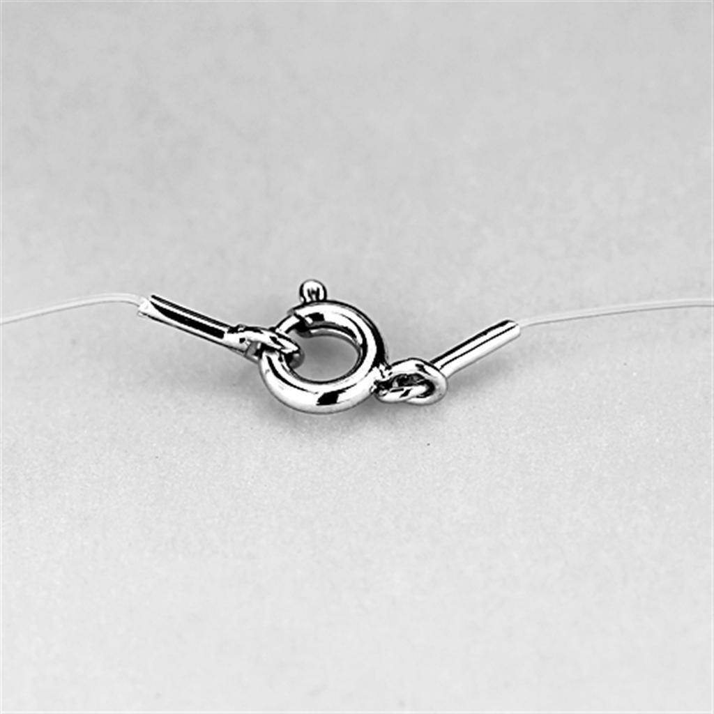 Close-up of the clasp on a dainty silver tone heart necklace showing secure closure design