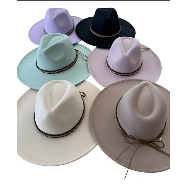 Dandy Panama Hat Vacation collection featuring various pastel colors and wide brims from Queens, INC