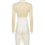 Back view of womens cropped tie front top in beige with long sleeves and open tie detail