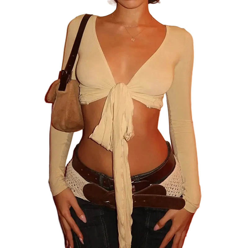 Womens cropped tie front top in beige with long sleeves styled with belt and bag