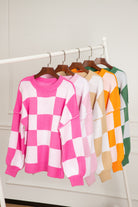 Women's SweatersOrange Checkered Bishop Sleeve Sweater - VacationGrabs