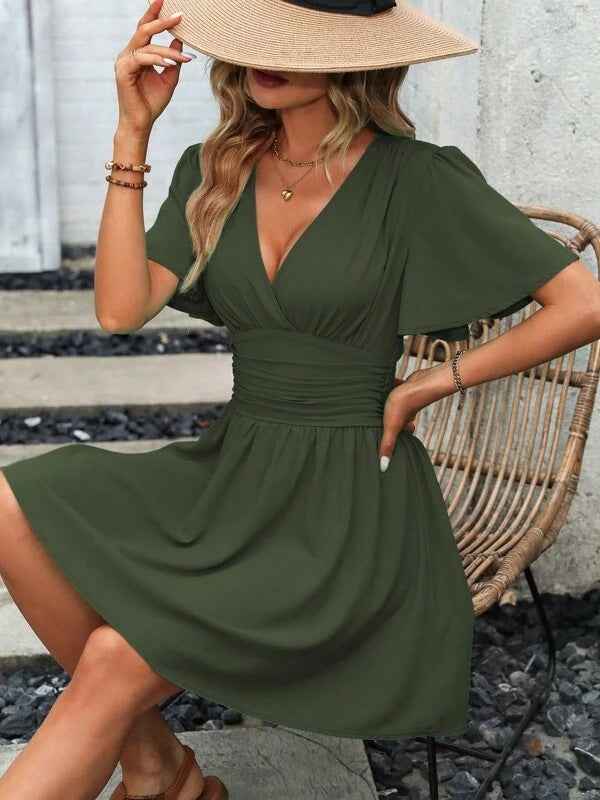 SHOMICOBOUTIQUE deep v waist pleated dress in olive green with flutter sleeves and a flattering fit