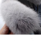 Gray denim jacket with plush fur collar for stylish warmth