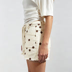 Women's cream denim shorts with brown polka dots for casual outings