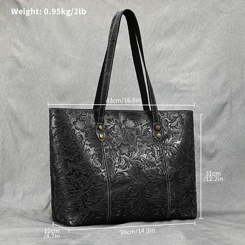 Stylish black designer shoulder bag for laptops with embossed floral pattern and sturdy straps