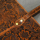 Intricate design of a VacationGrabs designer shoulder bag for laptops featuring detailed floral embossing