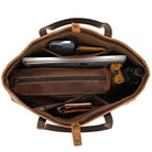 Spacious interior of a designer shoulder bag for laptops showing organized compartments and accessories