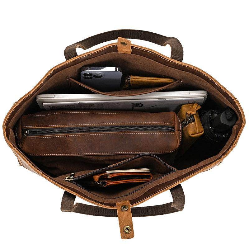Spacious interior of a designer shoulder bag for laptops showing organized compartments and accessories