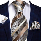 Elegant designer wedding ties for men featuring intricate patterns in silver and gold tones