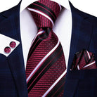 Elegant designer wedding ties for men in burgundy with striped pattern, accessorized with matching pocket square
