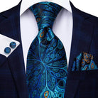 Elegant designer wedding ties for men featuring a vibrant peacock feather pattern and matching pocket square