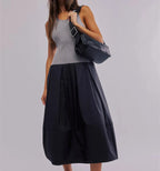 Women's black summer dress for the summer, featuring a ribbed top and flowing skirt