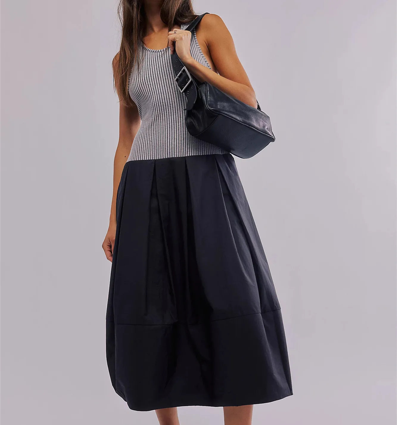 Women's black summer dress for the summer, featuring a ribbed top and flowing skirt