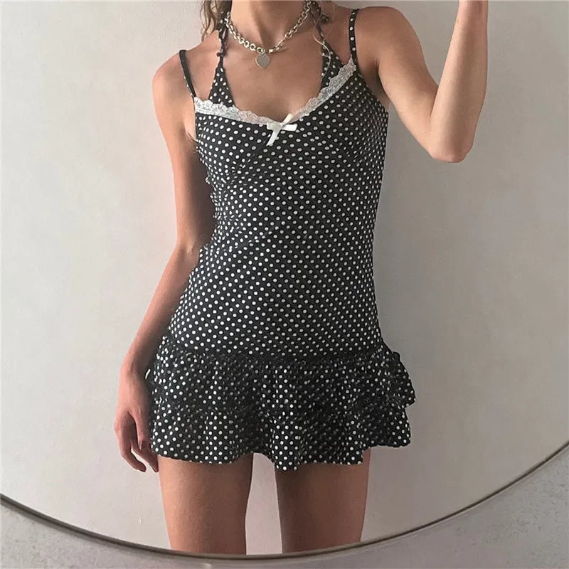 Black polka dot dress for the summer with a flared hem