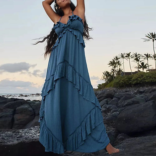 Women's blue tiered maxi dress for the summer, perfect for beach outings