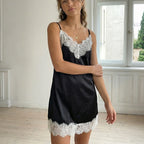 Women's black satin dress for wedding party guest with lace trim