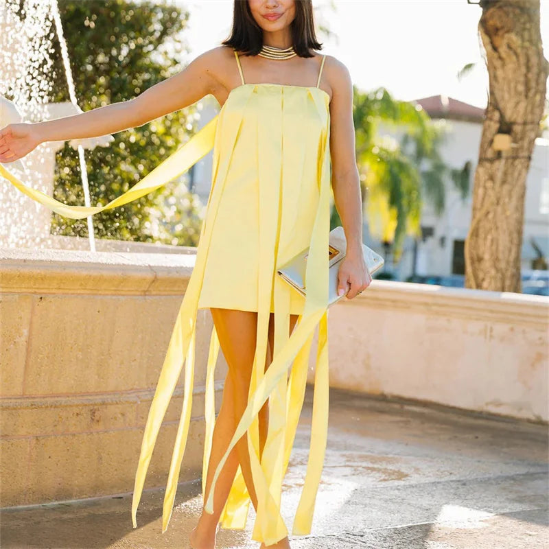 Yellow dress for wedding party guest with ribbon accents