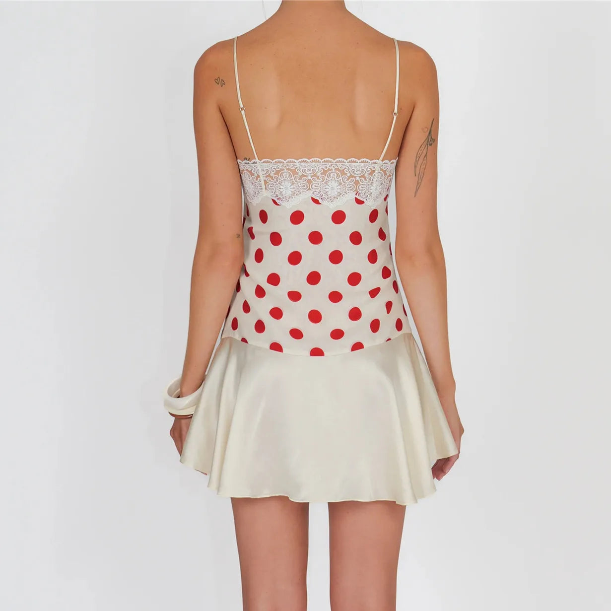 Women's white polka dot mini dress, perfect for summer outings