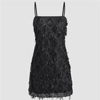 Black mini dress with tassel design, perfect for evening parties