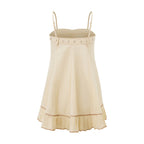 Women's cream mini dress with flared hem, perfect for summer outings