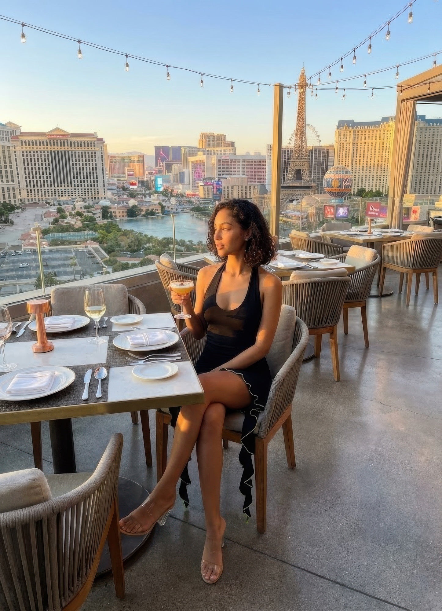 Elegant black mini dress perfect for dining out on vacation