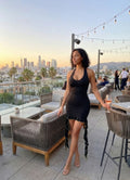 Black mini dress with halter neck, perfect for evening outings