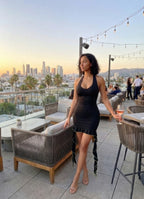 Black mini dress with halter neck, perfect for evening outings
