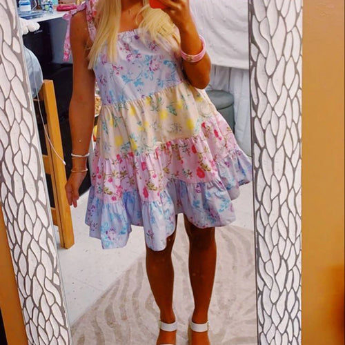 Women's floral mini dress in pastel colors, perfect for summer outings
