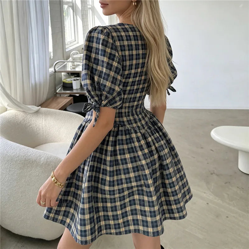 Women's plaid mini dress with puff sleeves, perfect for casual outings
