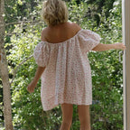 Women's off-shoulder mini dress in white with floral pattern, perfect for summer outings