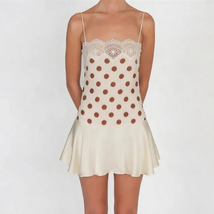 Beige mini dress with lace detailing and polka dots, perfect for summer outings