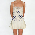 Cream mini dress with navy polka dots, perfect for summer outings