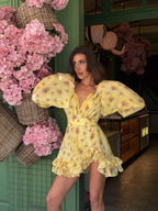 Women's yellow mini dress with floral print, perfect for summer outings