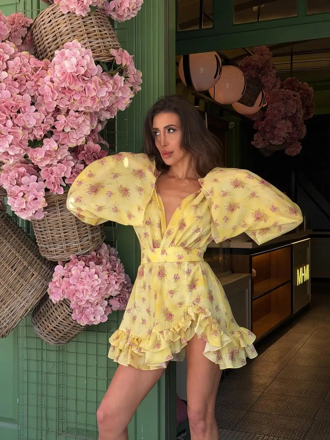 Women's yellow mini dress with floral print, perfect for summer outings