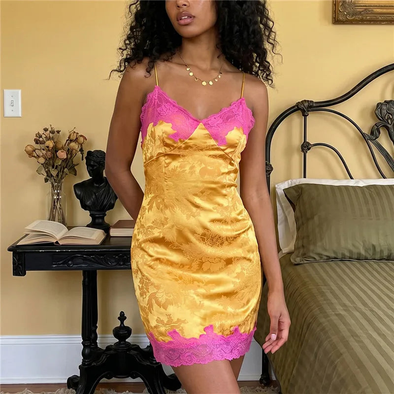 Women's satin mini dress in yellow with pink lace trim for summer outings