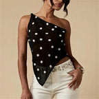 Black sheer one-shoulder top with white polka dot design