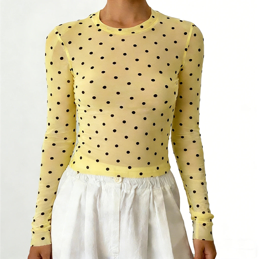 Yellow long-sleeve sheer top with black polka dots for casual outings