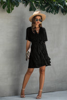Women's black dress wrap in lightweight fabric, perfect for summer outings