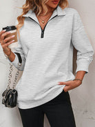 Trendsi women's dropped shoulder pullover top in gray with a zip collar and relaxed fit