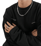 Men's jewelry featuring a stylish dual design necklace chain worn with a black sweatshirt