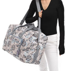 Floral print duffle bag with adjustable straps, perfect for travel
