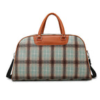 Plaid duffle bag with brown leather accents for travel or daily use