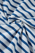 Close-up of fabric showing striped drop shoulder sweatshirt in blue and white colors