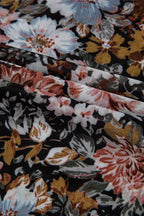 Close-up of JUNIPER BLVD mock neck floral blouse for women featuring vibrant floral patterns