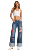 Woman wearing blue jeans with patches on a white background