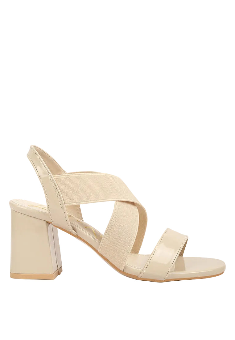 Beige high-heeled sandal on a white background