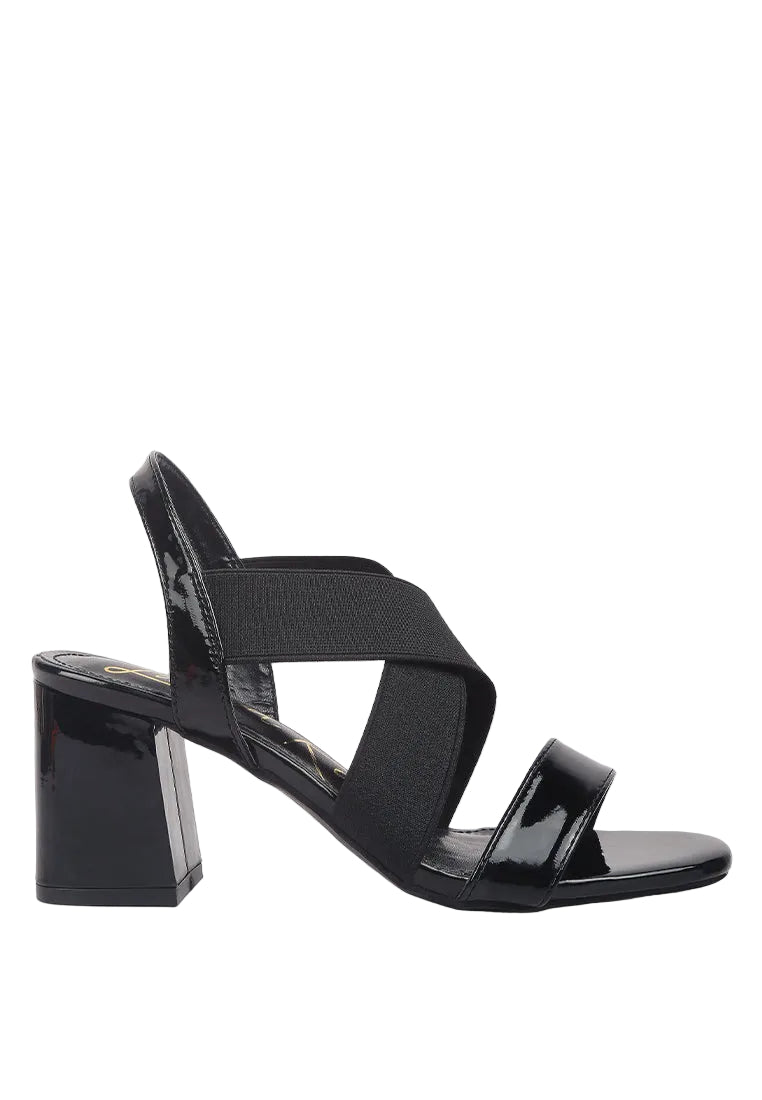 Black sandal with multiple straps on a white background
