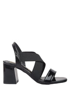 Black sandal with multiple straps on a white background